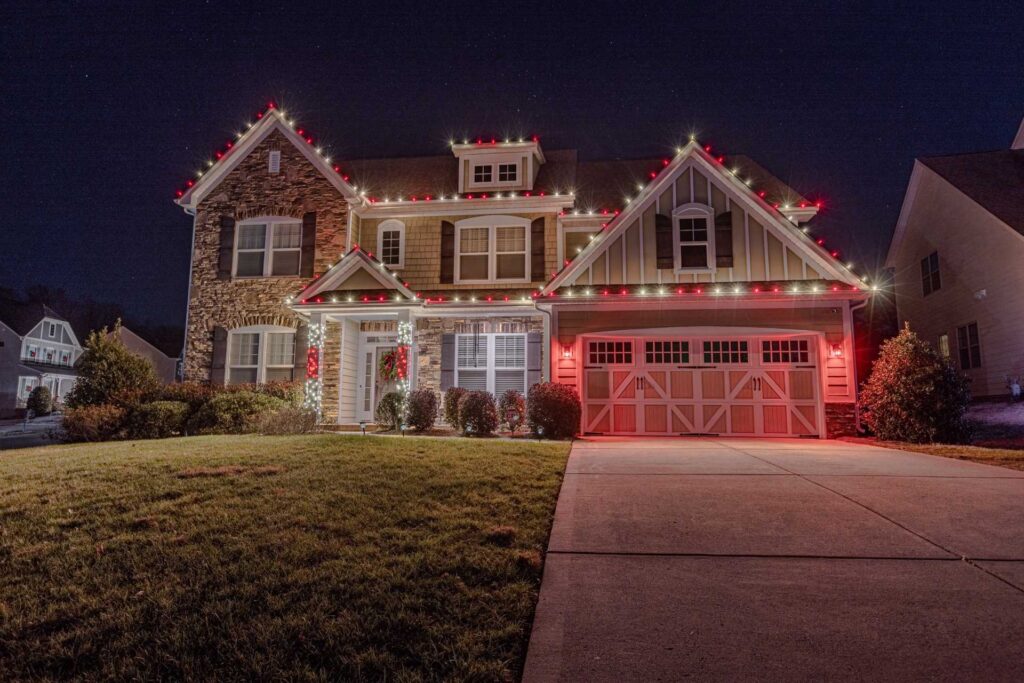 Red and white Christmas light installation on a Cobb County home