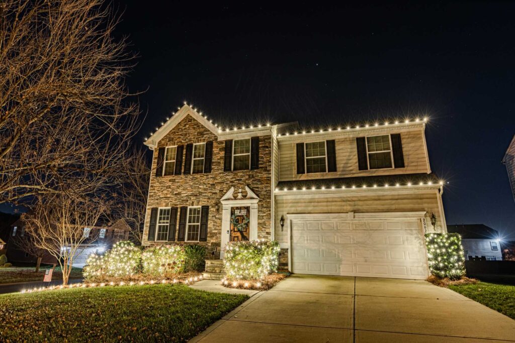 Professional Christmas light service on a two-story home